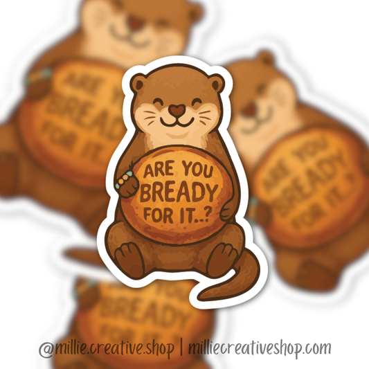 Sticker of an otter holding a loaf of sourdough bread with text 'Are you bready for it?' on a blurred background.