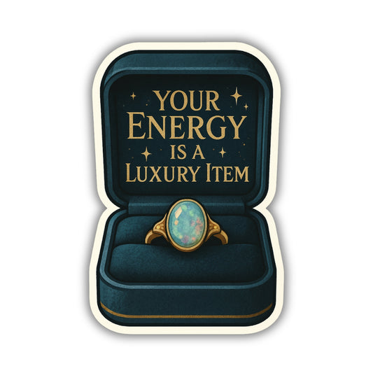 Ring in a box with 'Your Energy is a Luxury Item' text on a white background